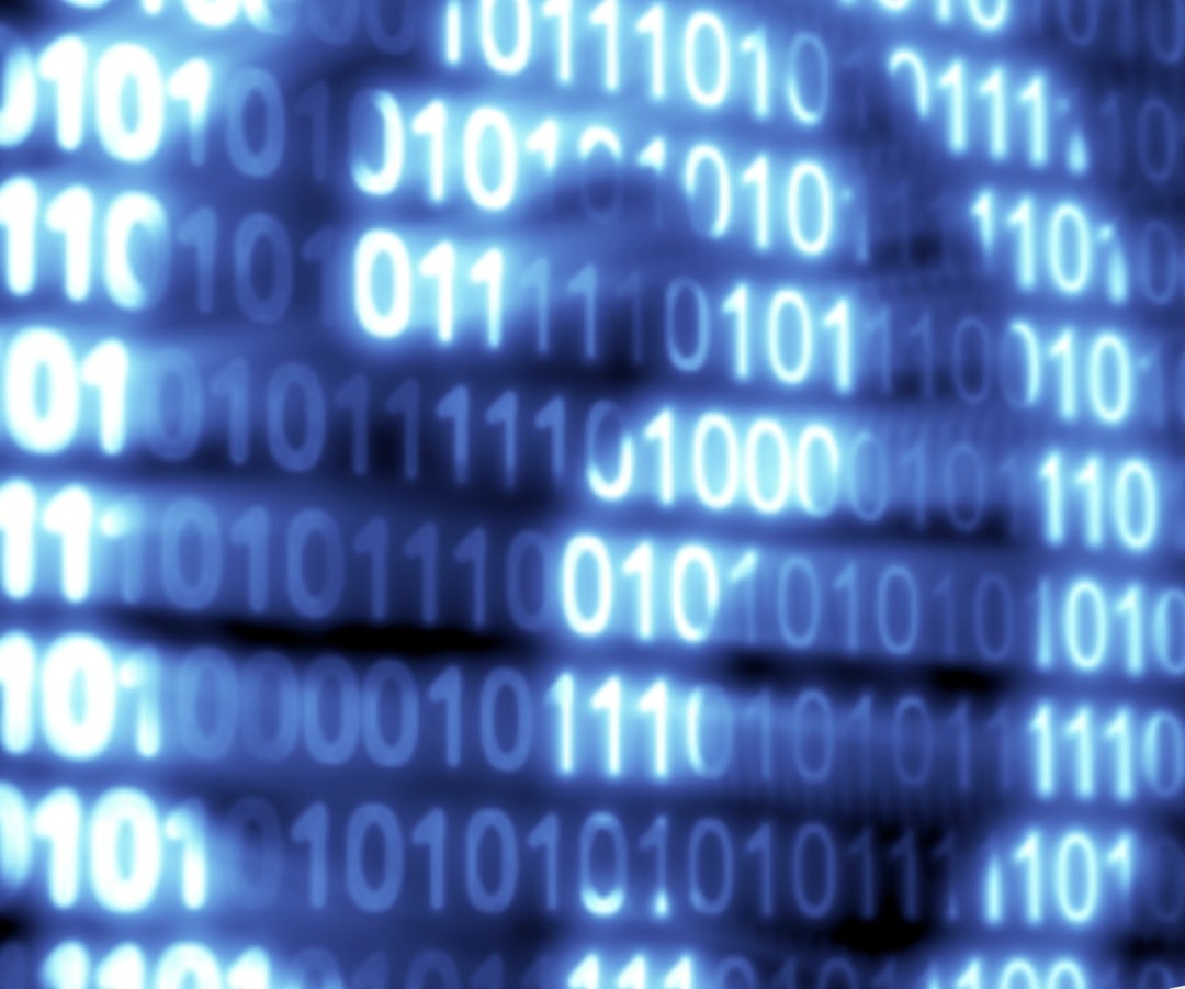 Image of glowing blue binary code.